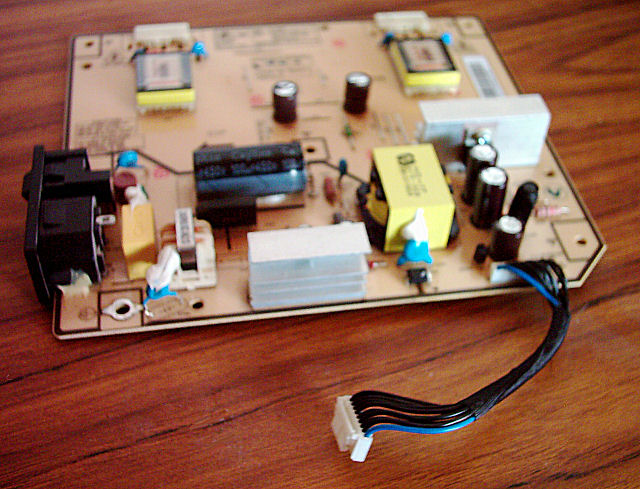 Picture of the top side of my 204B's power supply board with the new capacitors in place